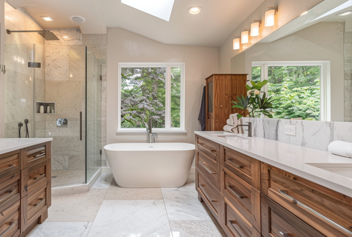 Modern bathroom featuring freestanding tub, vanity, and shower